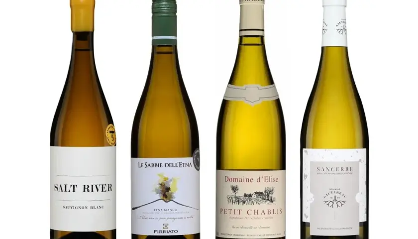 Quatre bouteilles de vin blanc, dont un Sancerre, un Petit Chablis et un Etna Bianco, offrant un potentiel de meilleur vin blanc minéral.